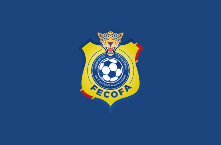 FECOFA logo (Congolese Football Federation) with a leopard head atop a yellow shield and blue circle containing a soccer ball, on a blue background FECOFA logo (Congolese Football Federation) with a leopard head atop a yellow shield and blue circle containing a soccer ball, on a blue background