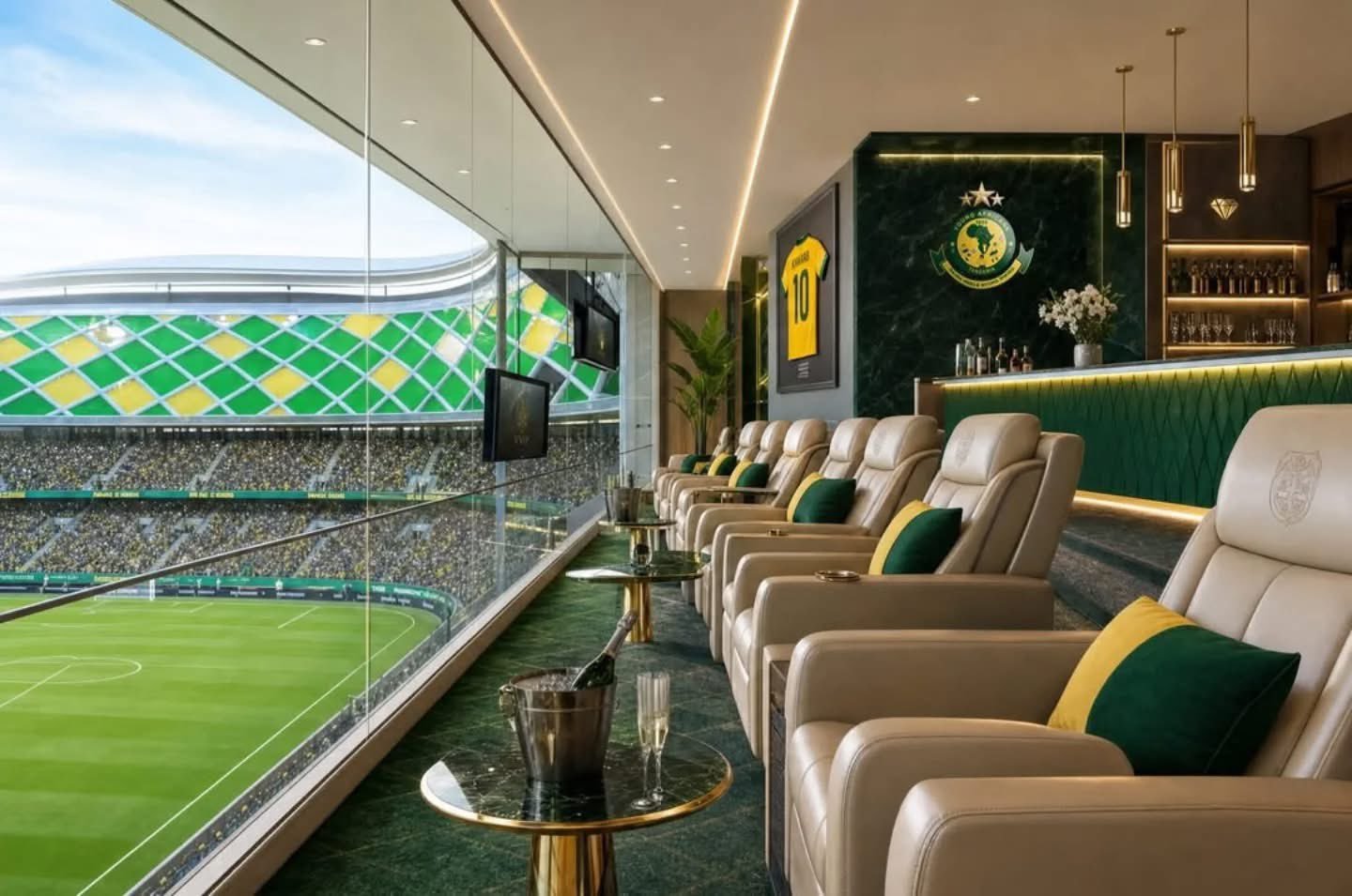 VIP stadium lounge with cream leather recliners and green-yellow cushions, facing a glass wall onto a soccer field.