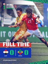 Soccer moment with two players contesting the ball; overlay reads FULL TIME with a 0–0 score and team flags at the bottom. Soccer moment with two players contesting the ball; overlay reads FULL TIME with a 0–0 score and team flags at the bottom.
