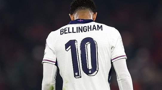 Back view of a footballer wearing a white jersey with the large number 10 on the back.
