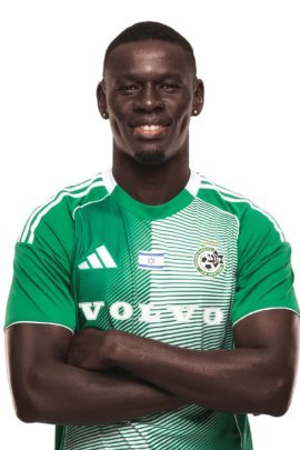 Male football player in a green jersey with Volvo sponsor, arms crossed and smiling at the camera. Male football player in a green jersey with Volvo sponsor, arms crossed and smiling at the camera.