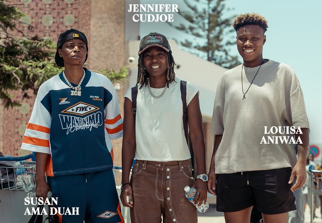 Three young people pose outdoors in casual streetwear; left in blue/orange jersey and cap, center in white top with brown button skirt, right in beige tee and black shorts, with names overlaid in white text. Three young people pose outdoors in casual streetwear; left in blue/orange jersey and cap, center in white top with brown button skirt, right in beige tee and black shorts, with names overlaid in white text.