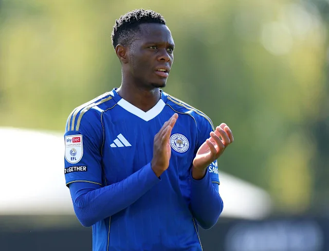Male football player in a blue Leicester City kit clapping on the field during training or a match.