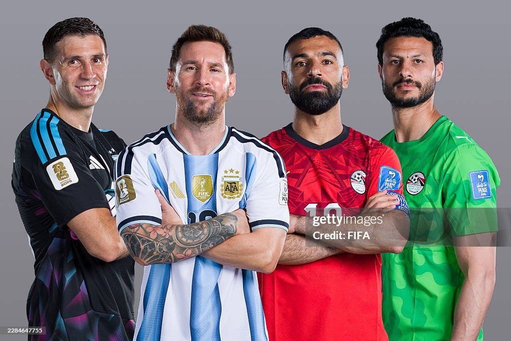 Four male football players stand together with arms crossed in team jerseys (Argentina, red-clad, green keeper) for a sports photo. Four male football players stand together with arms crossed in team jerseys (Argentina, red-clad, green keeper) for a sports photo.
