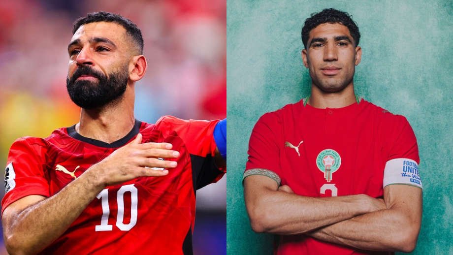 Two male soccer players in red jerseys are shown side by side; left has number 10 and gestures toward the chest, right stands with arms crossed against a teal background.
