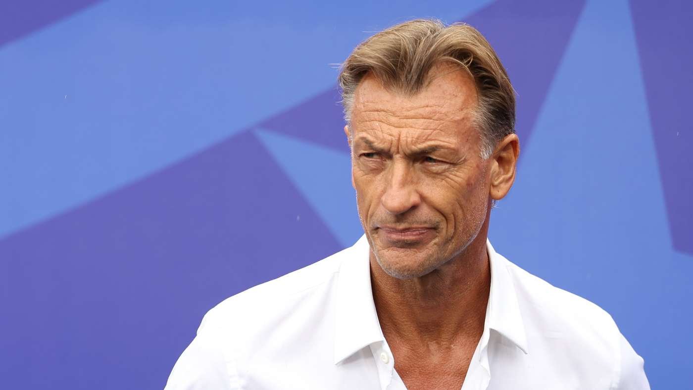 Close-up of a middle-aged man with light brown hair wearing a white shirt, looking to the left, against a blue geometric background. Close-up of a middle-aged man with light brown hair wearing a white shirt, looking to the left, against a blue geometric background.