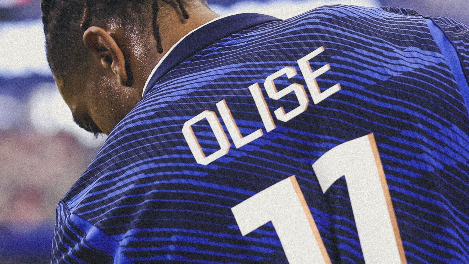 Close-up of a person wearing a blue striped sports jersey from the back, showing a large white number on the back. Close-up of a person wearing a blue striped sports jersey from the back, showing a large white number on the back.