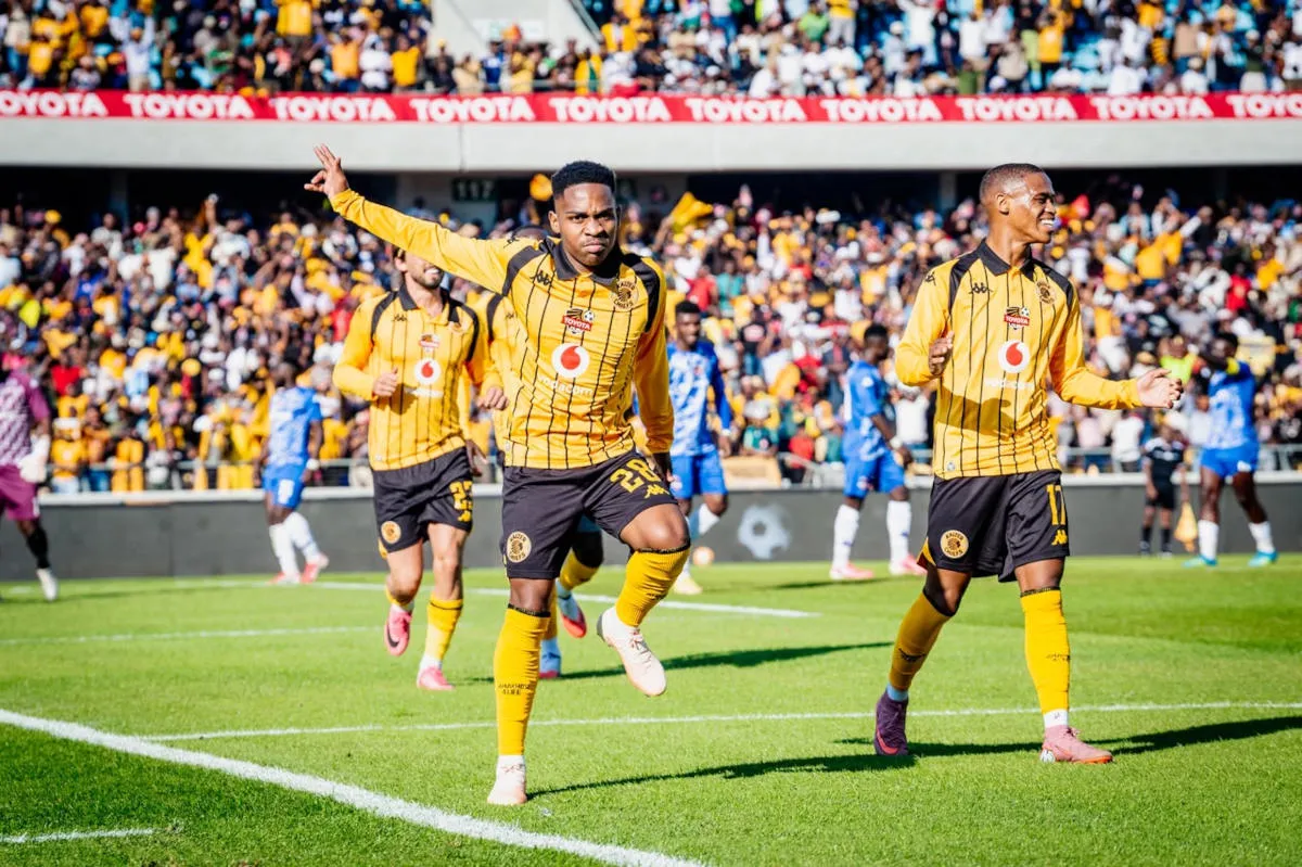 Soccer players in yellow striped jerseys celebrate on a sunny field as fans cheer in the stands behind them, Toyota banners visible. Soccer players in yellow striped jerseys celebrate on a sunny field as fans cheer in the stands behind them, Toyota banners visible.
