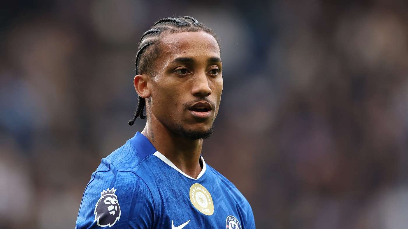 Chelsea FC player with braided hair in a blue kit on the pitch during a match.